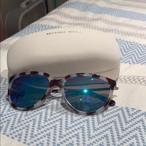 MK sunglasses with blue reflective lenses